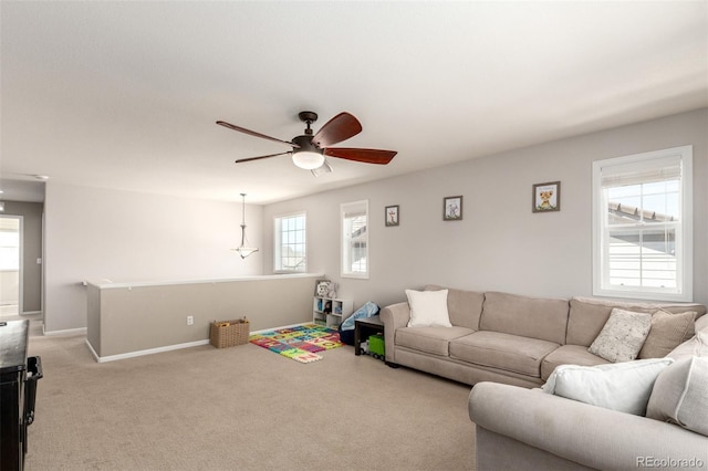 2881 Black Canyon Way, Castle Rock, CO 80109 - living area with a ceiling fan, baseboards, and light carpet