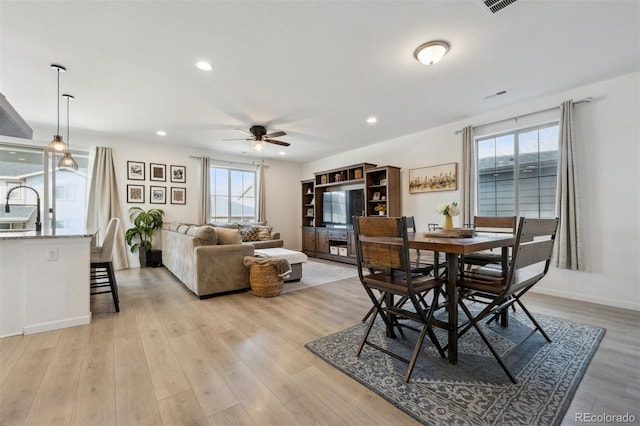 dining space featuring ceiling fan, recessed lighting, visible vents, baseboards, and light wood-type flooring