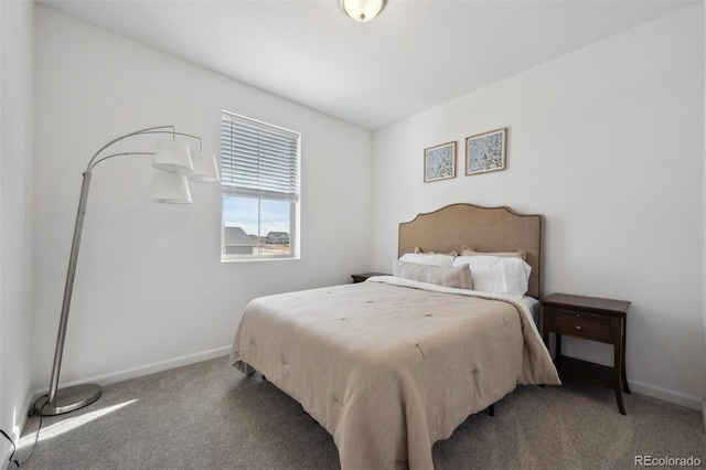 bedroom featuring baseboards and light colored carpet