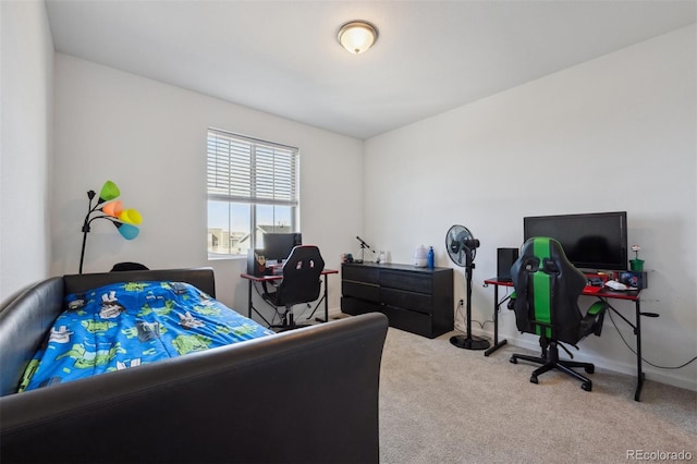 carpeted bedroom with baseboards