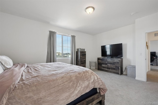 bedroom with light carpet and visible vents