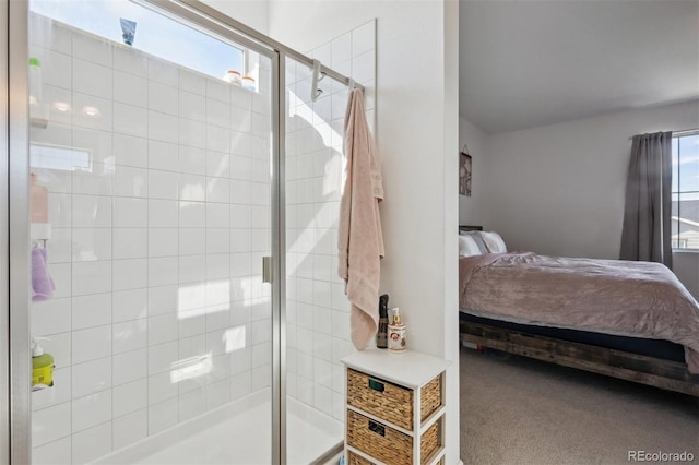 bathroom featuring a tile shower and ensuite bath