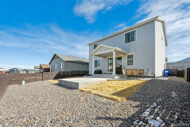 back of house featuring a patio and a fenced backyard