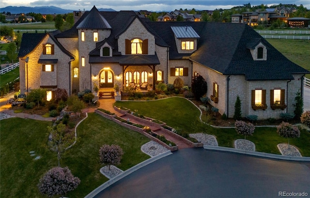 15355 Zuni St, Broomfield, CO 80023 - french country home with stone siding, a standing seam roof, and a mountain view