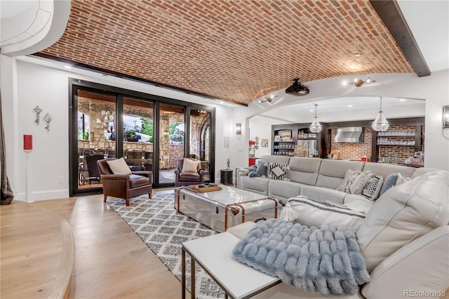 15355 Zuni St, Broomfield, CO 80023 - living area with brick ceiling, light wood-type flooring, baseboards, and vaulted ceiling