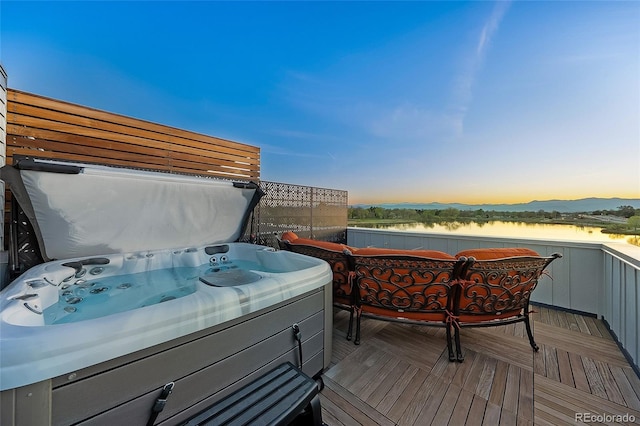 3101 W 47th Ave Unit 13, Denver, CO 80211 - deck at dusk featuring a hot tub
