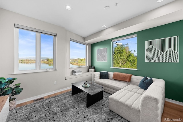 3101 W 47th Ave Unit 13, Denver, CO 80211 - living area featuring plenty of natural light, recessed lighting, wood finished floors, and baseboards