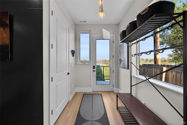 3101 W 47th Ave Unit 13, Denver, CO 80211 - entryway with baseboards and light wood-type flooring