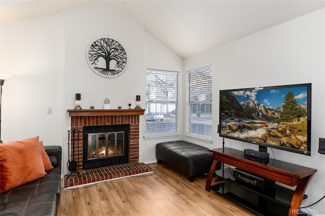 9333 Cattail Ct, Highlands Ranch, CO 80126 - living area featuring a fireplace, high vaulted ceiling, and wood finished floors