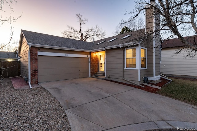 9333 Cattail Ct, Highlands Ranch, CO 80126 - ranch-style house featuring roof with shingles, brick siding, concrete driveway, a garage, and a chimney