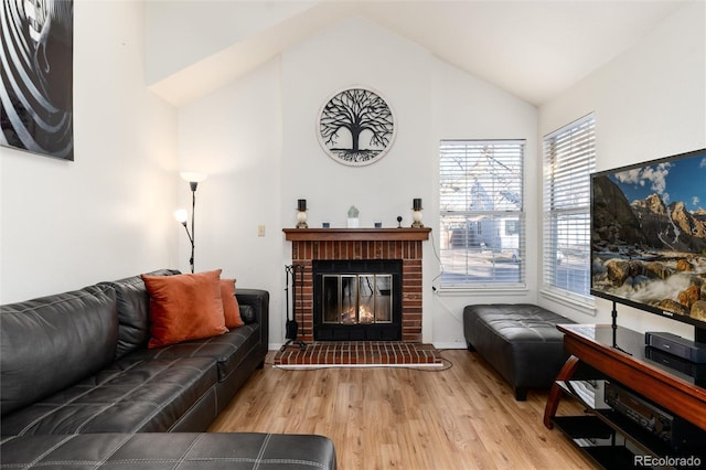 9333 Cattail Ct, Highlands Ranch, CO 80126 - living area featuring a fireplace, baseboards, high vaulted ceiling, and wood finished floors
