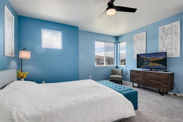 carpeted bedroom with ceiling fan