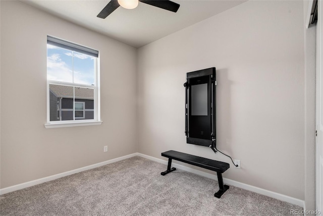 carpeted spare room with ceiling fan