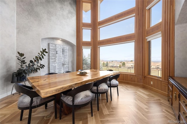 2421 Ranch Reserve Rdg, Denver, CO 80234 - dining room with baseboards and a towering ceiling