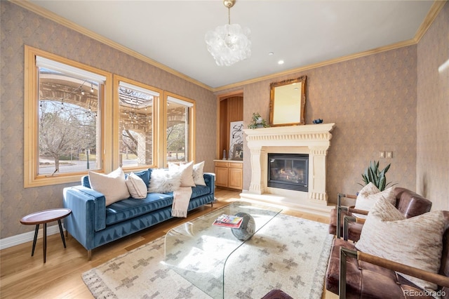 2421 Ranch Reserve Rdg, Denver, CO 80234 - living room with wallpapered walls, light wood-style flooring, healthy amount of natural light, a chandelier, and a glass covered fireplace