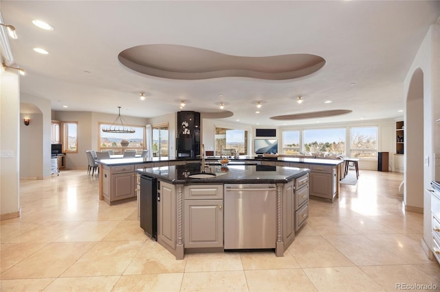 2421 Ranch Reserve Rdg, Denver, CO 80234 - kitchen with dishwasher, a spacious island, plenty of natural light, recessed lighting, and a raised ceiling