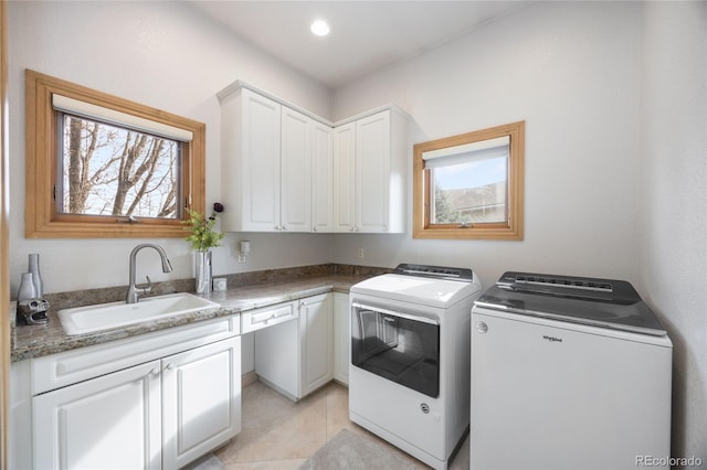 2421 Ranch Reserve Rdg, Denver, CO 80234 - laundry area featuring washer and clothes dryer, cabinet space, light tile patterned flooring, and recessed lighting
