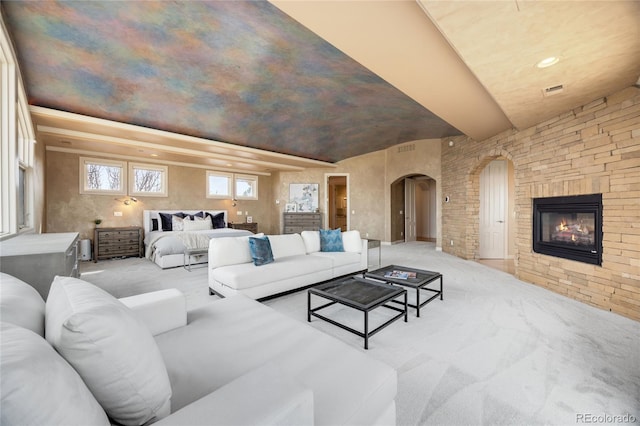 2421 Ranch Reserve Rdg, Denver, CO 80234 - living area featuring arched walkways, carpet, and a fireplace