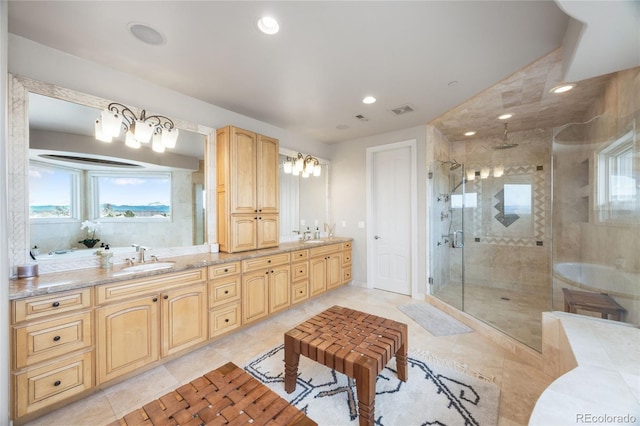 2421 Ranch Reserve Rdg, Denver, CO 80234 - full bath featuring a shower stall, healthy amount of natural light, double vanity, a tub, and recessed lighting