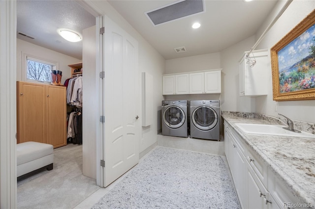 2421 Ranch Reserve Rdg, Denver, CO 80234 - laundry area with separate washer and dryer and cabinet space