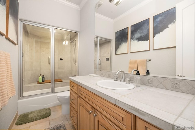 2421 Ranch Reserve Rdg, Denver, CO 80234 - full bathroom with ornamental molding, vanity, bath / shower combo with glass door, and tile patterned floors