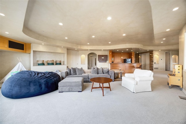 2421 Ranch Reserve Rdg, Denver, CO 80234 - living area featuring light carpet, recessed lighting, and a raised ceiling
