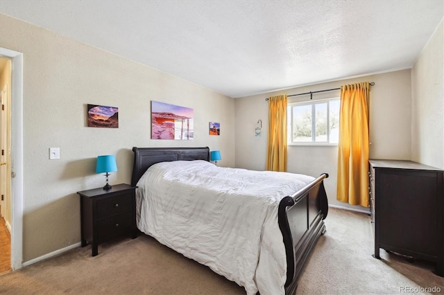 bedroom featuring baseboards and light colored carpet