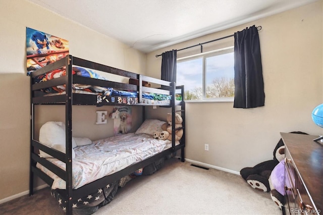 bedroom with visible vents, carpet, and baseboards