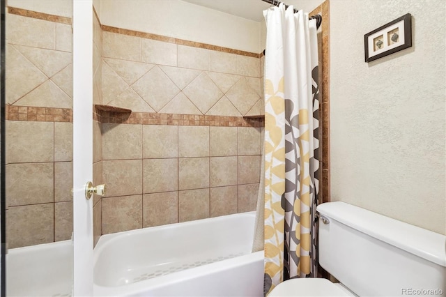 full bath featuring shower / bath combo with shower curtain and toilet