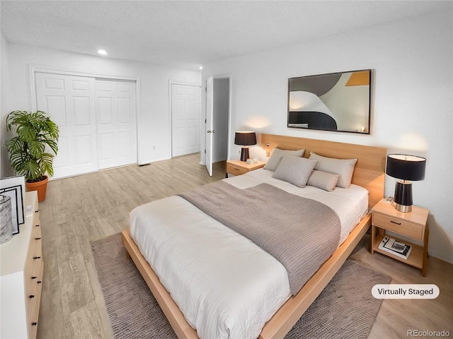 bedroom featuring light wood-type flooring