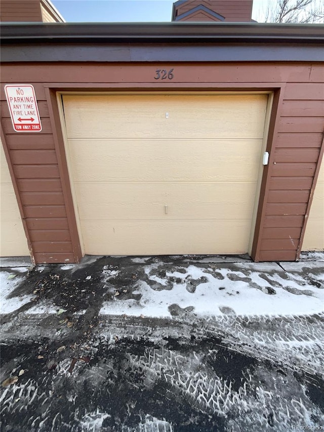 view of snow covered garage