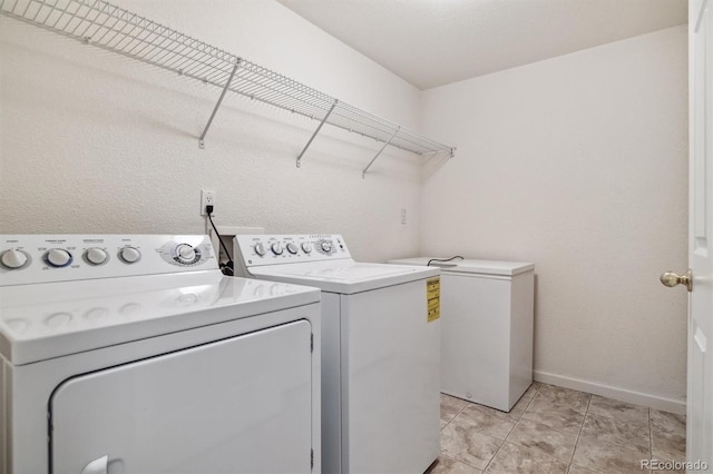 laundry room featuring washing machine and clothes dryer