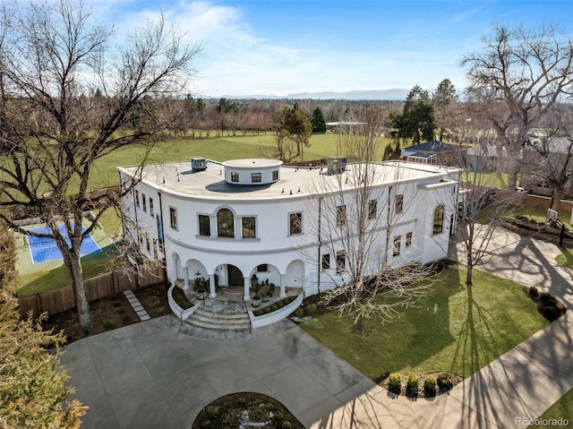 exterior space featuring driveway and fence