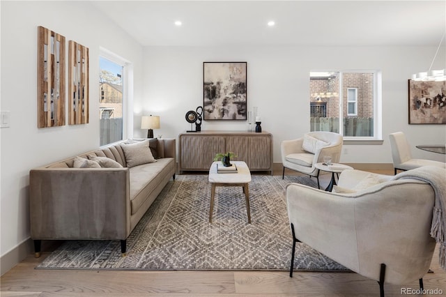 living room featuring radiator and light hardwood / wood-style floors