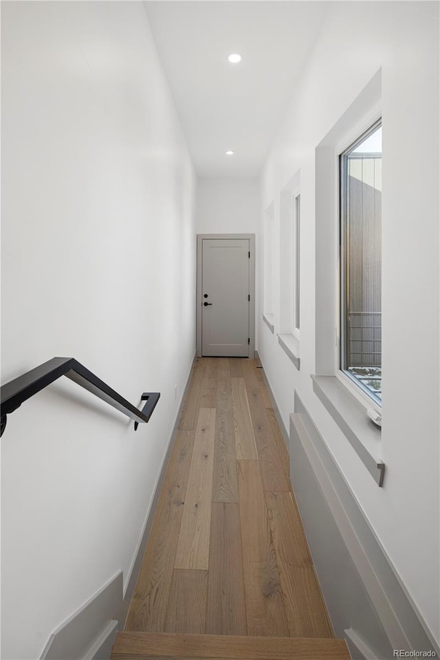 hall with light hardwood / wood-style flooring