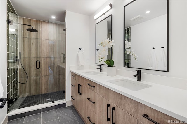 bathroom featuring walk in shower, vanity, and tile patterned floors