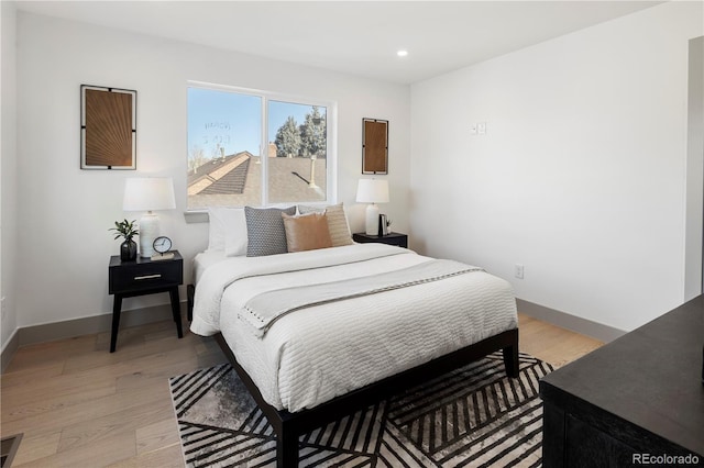 bedroom with light hardwood / wood-style floors