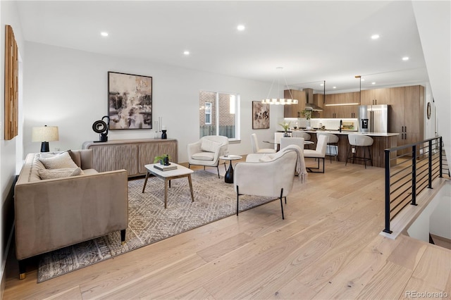 living room with light hardwood / wood-style flooring