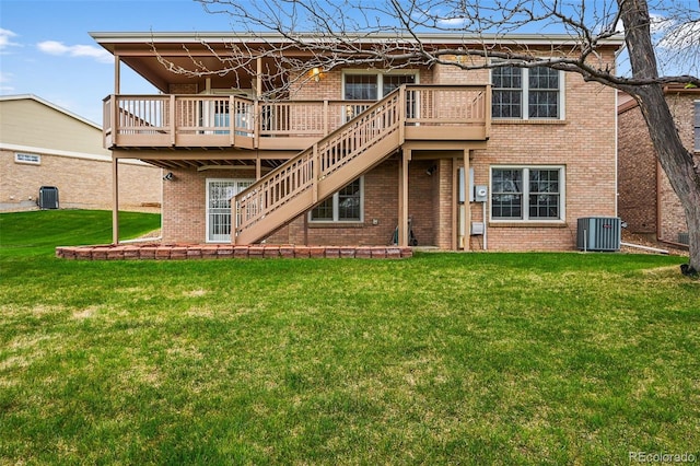 rear view of property with a wooden deck, cooling unit, brick siding, stairs, and a yard