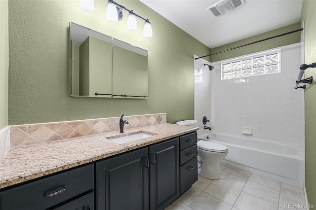 full bathroom with shower / bathing tub combination, visible vents, vanity, tile patterned floors, and toilet
