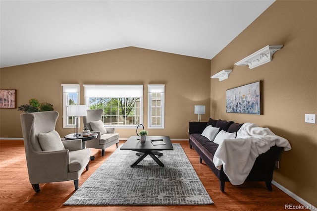 4927 Greenwich Way, Highlands Ranch, CO 80130 - living area featuring vaulted ceiling and wood finished floors