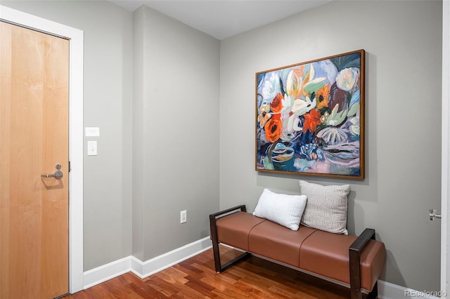 1631 N Emerson St Unit 117, Denver, CO 80218 - sitting room featuring baseboards and wood finished floors