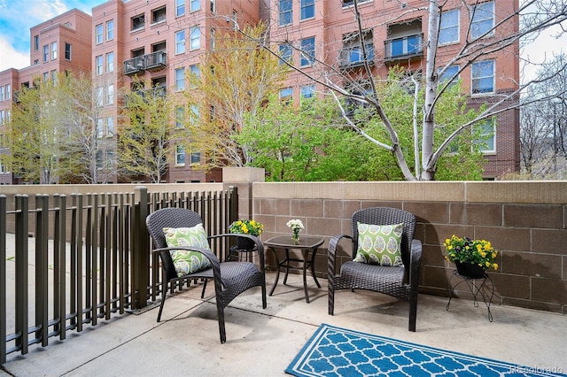 1631 N Emerson St Unit 117, Denver, CO 80218 - balcony featuring a patio