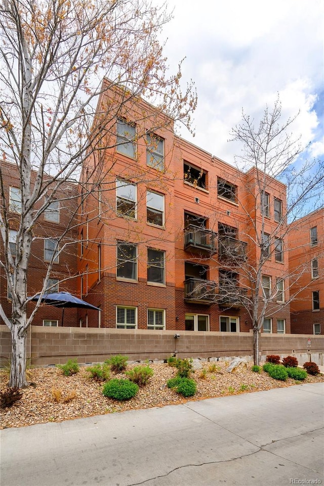 1631 N Emerson St Unit 117, Denver, CO 80218 - view of property with fence