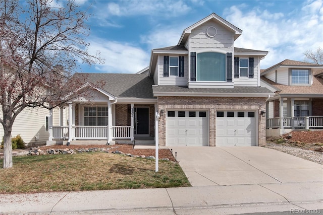 traditional-style house with brick siding, covered porch, an attached garage, and driveway