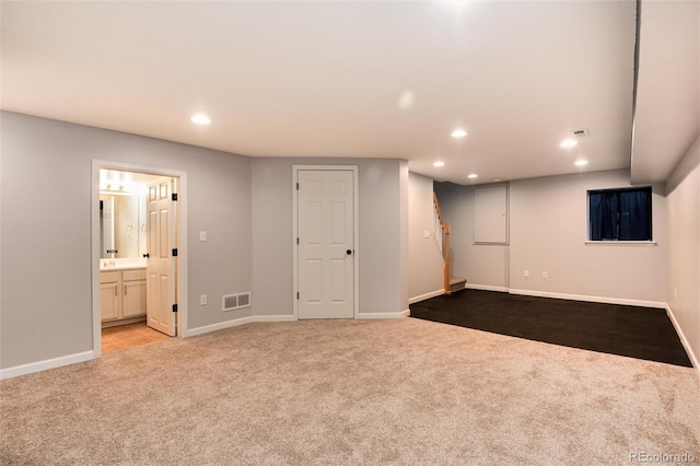 finished basement featuring recessed lighting, carpet, visible vents, and baseboards