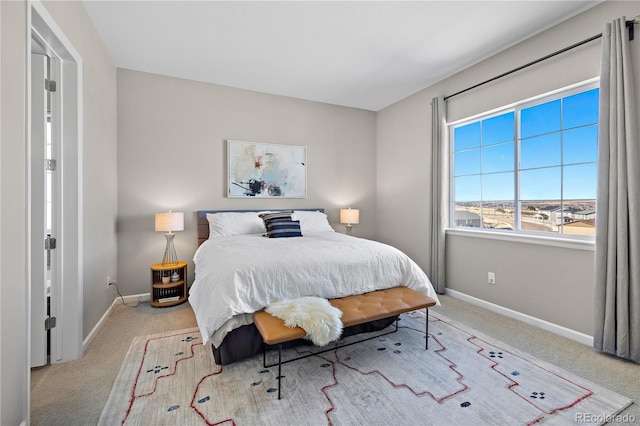 carpeted bedroom with baseboards