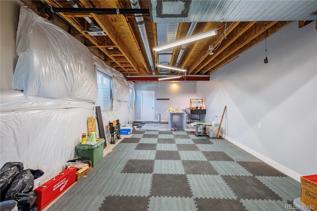 basement featuring baseboards