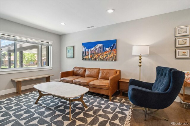 3040 S Dexter Way, Denver, CO 80222 - living area featuring baseboards, wood finished floors, and recessed lighting
