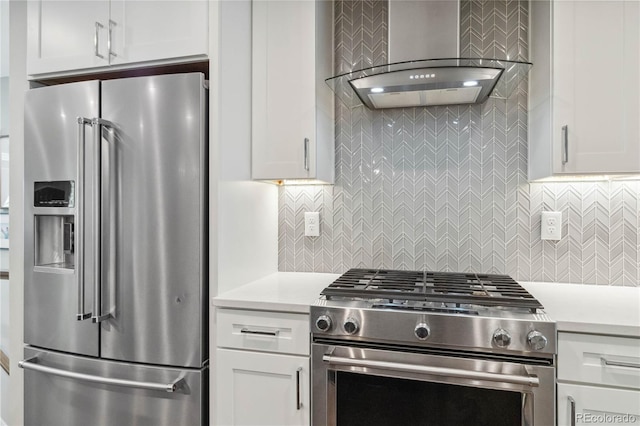 3040 S Dexter Way, Denver, CO 80222 - kitchen with stainless steel appliances, wall chimney exhaust hood, light countertops, and white cabinets